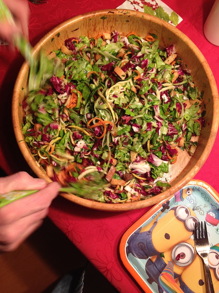 Mixing Salad with Onions with greens and carrots