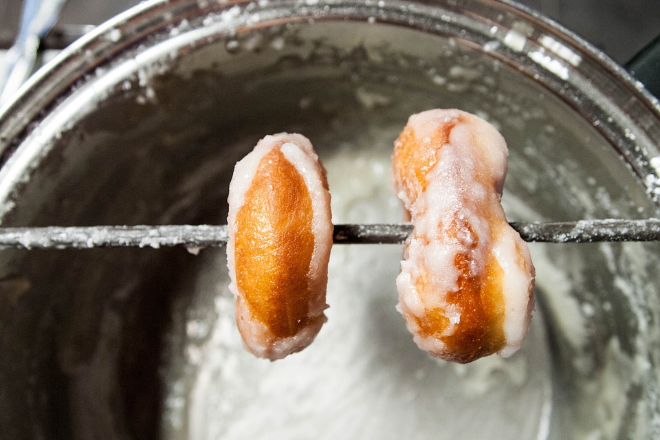 Donuts being glazed
