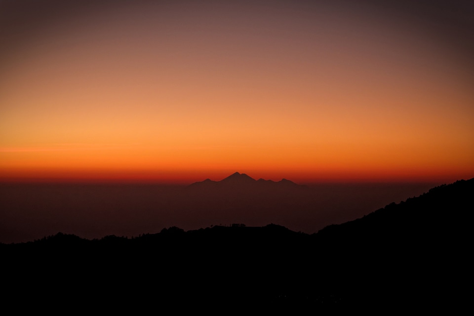 Sunset and Dawn and a far peak and landscape photo