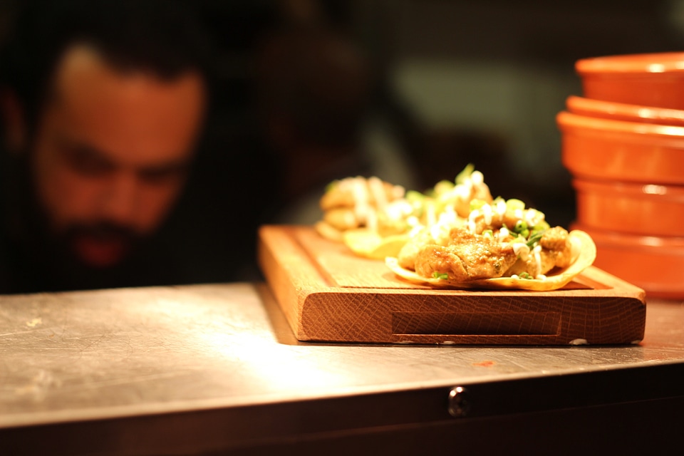 Tacos on the shells on wood slab