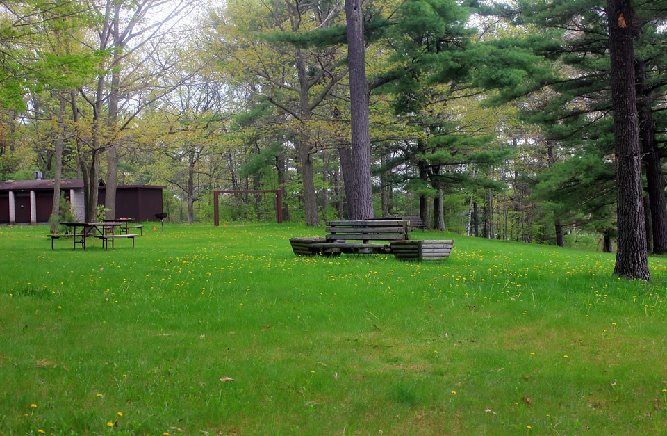 Bench with grassy field at Council Grounds State Park, Wisconsin