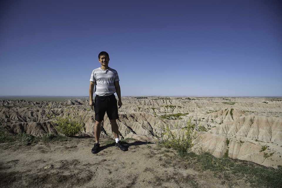 Standing on the edge of a cliff at Badlands National Park