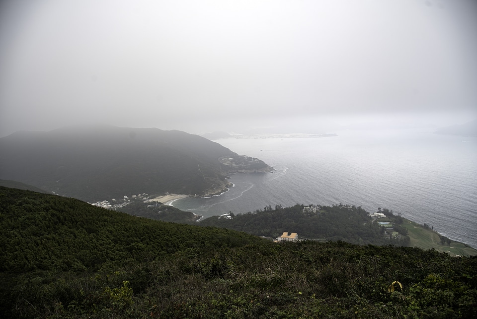 Mountainside foggy landscape with sea