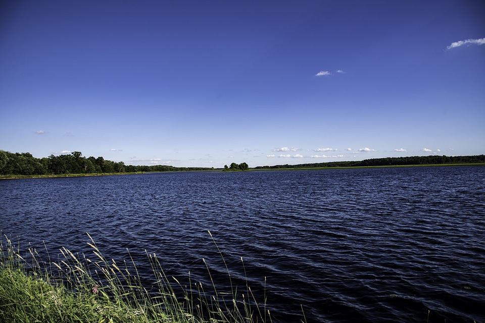 Lake with water under blue sky