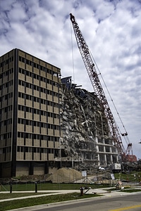 Building getting demolished by wrecking ball