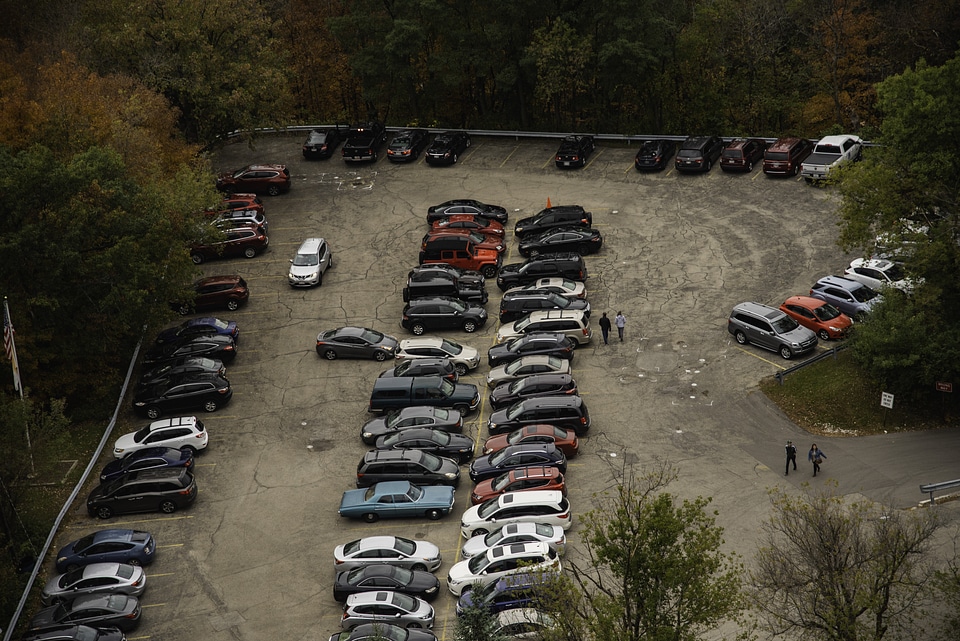 Cars and people in the parking lot photo