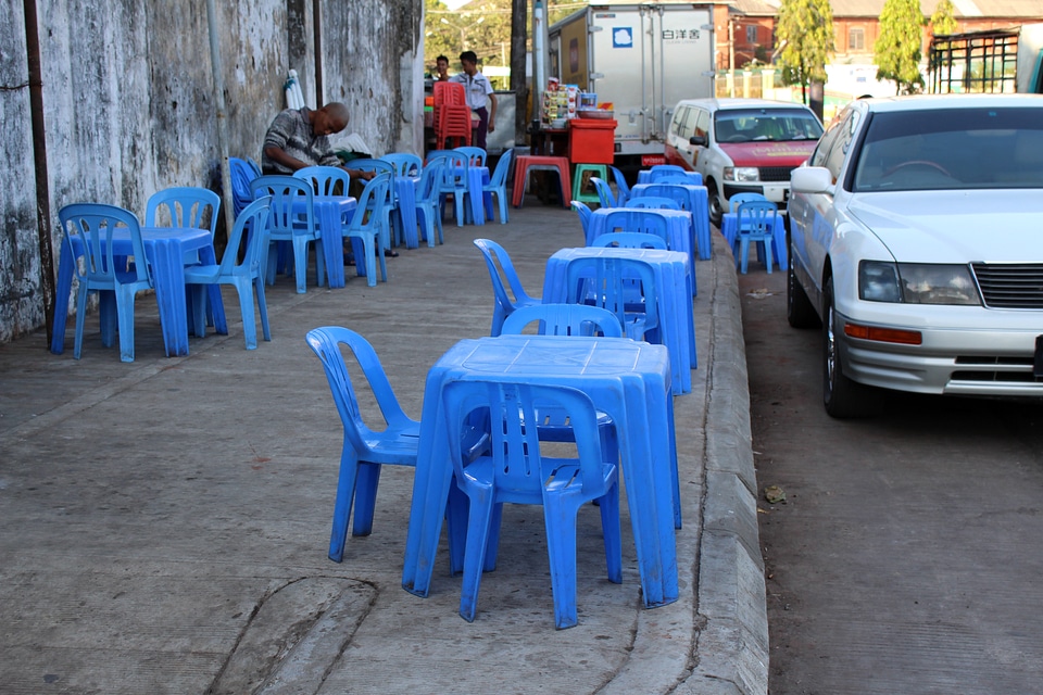 Teashop on Pavement with blue plastic tables
