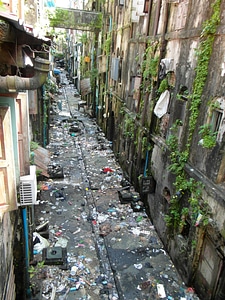Dirty street back alley in Yangon Myanmar photo