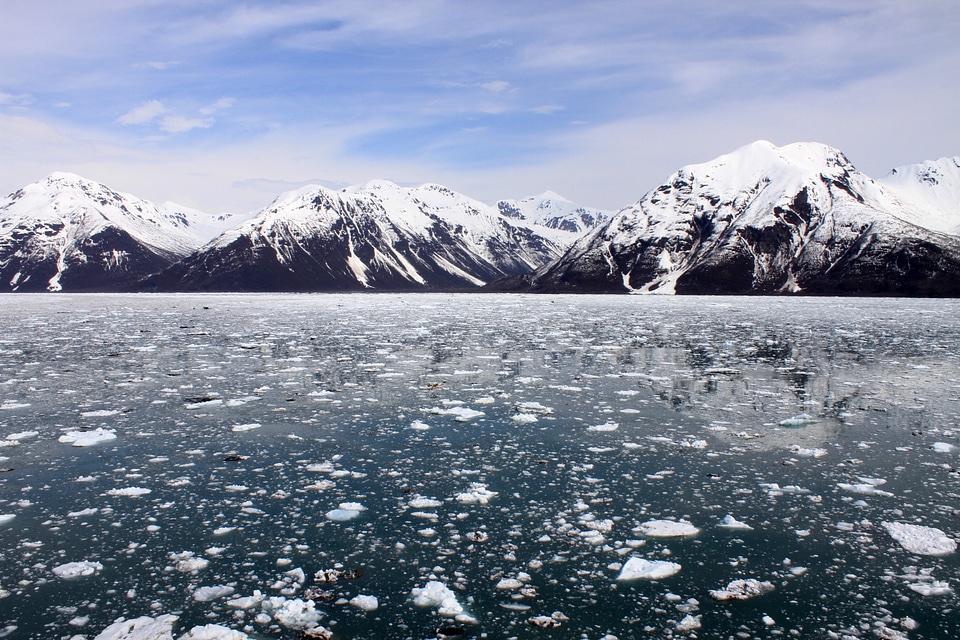 Landscape with snow-capped mountains with ice and water in Alaska photo
