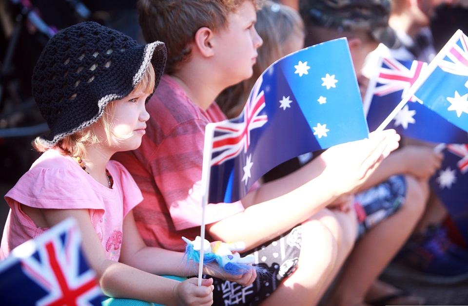 Children wave Australian Flags during Parade in Darwin, Australia