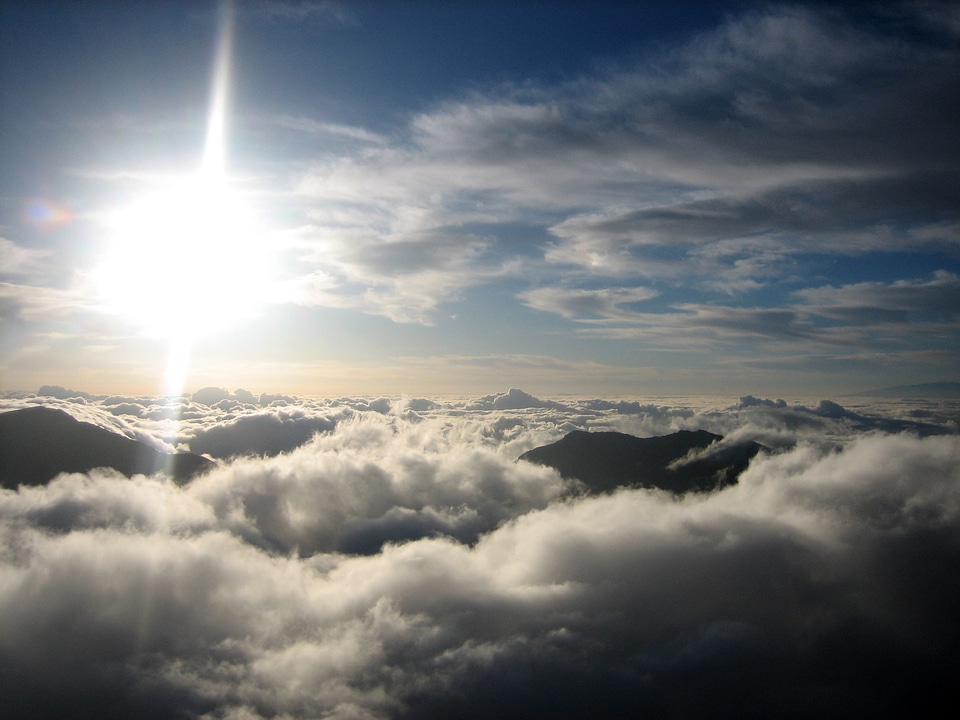 Sea of clouds with the bright sun on Haleakala National Park, Hawaii