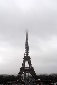 Eiffel Tower going into the fog and mist photo