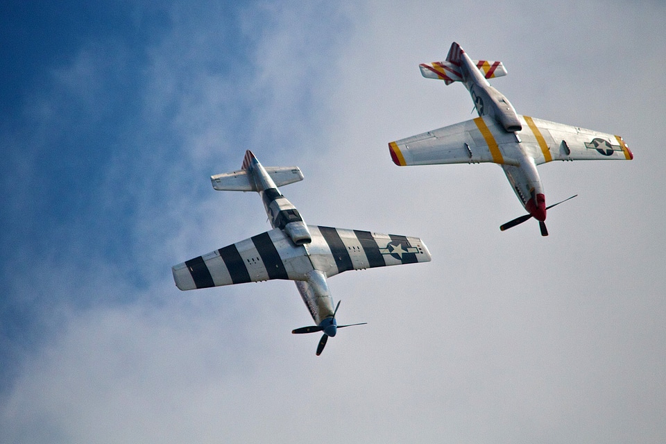 Two P-51 Mustangs in an airshow