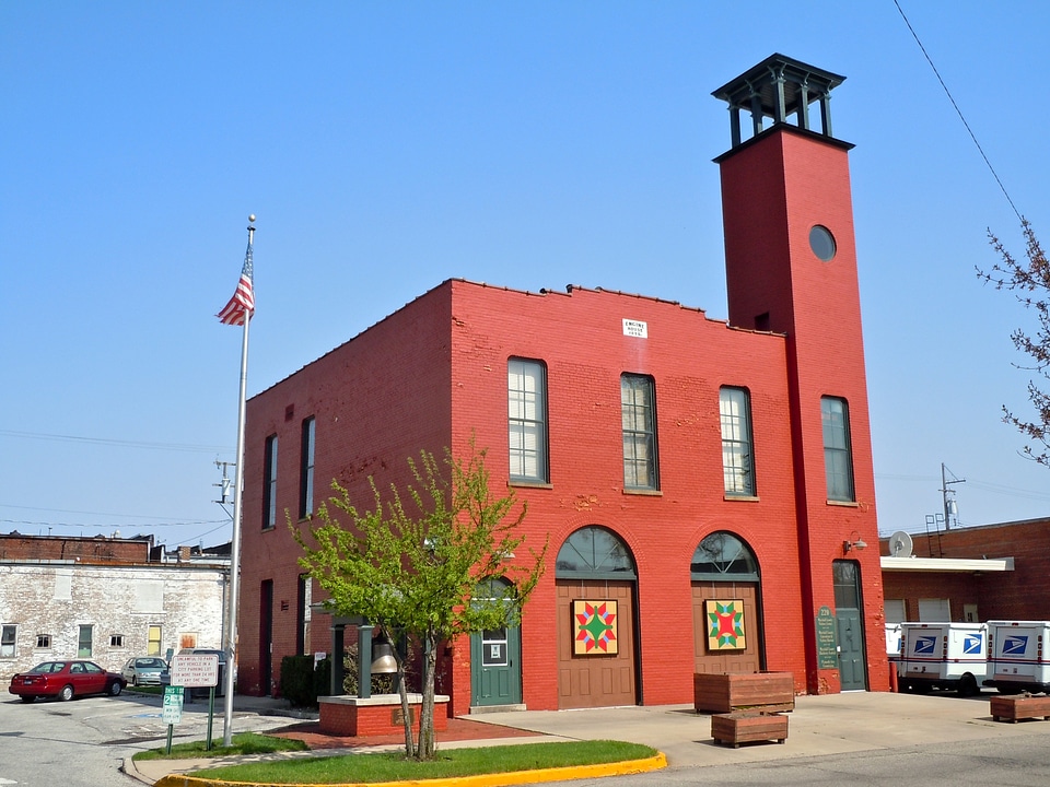 Historic fire station with patchwork quilt designs on doors in Indiana
