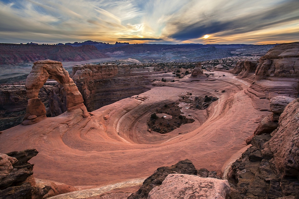 Dramatic Landscape and Sunset over clouds in Arches National Park