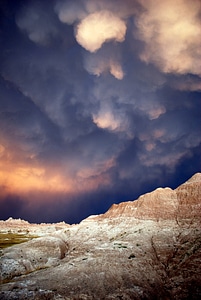 Storm Clouds over the rocky landscape in Badlands National Park photo