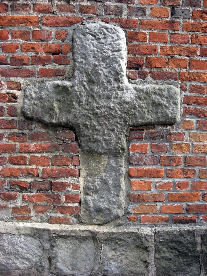 Romanesque cross on the north wall of St. Bartholomew's Church in Konin photo