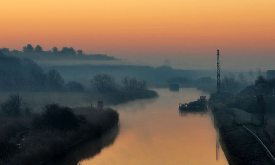 Dawn on the river on a misty morning
