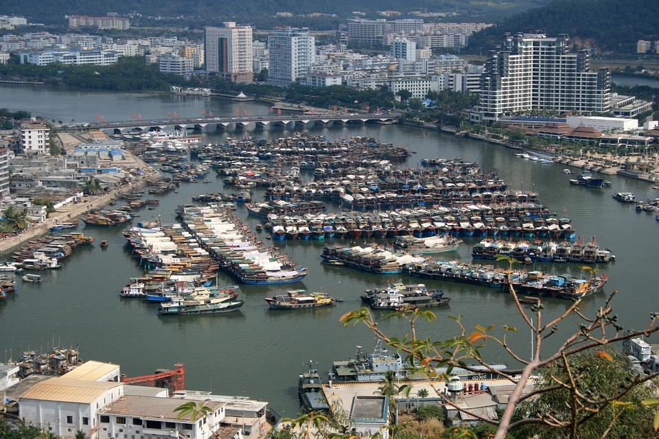 Boats and buildings with cityscape in Sanya photo