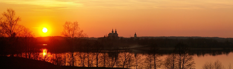 Sunset over the castle and the water photo