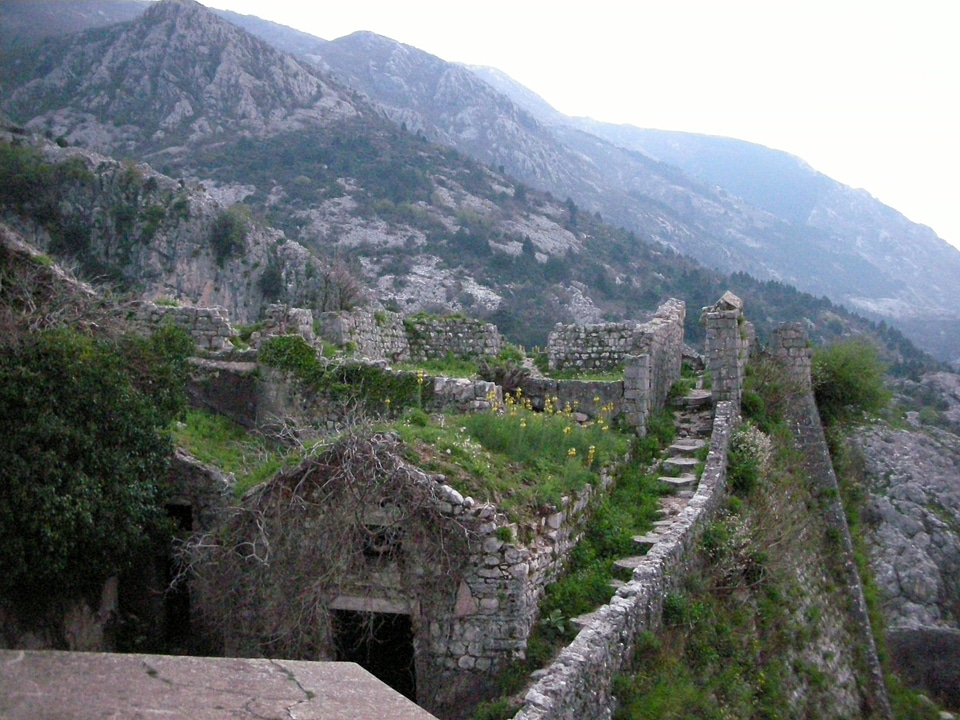 Stairs and mountainside stone buildings in Kotor, Montenegro