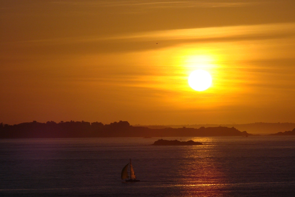 Orange Sunset beach landscape in St. Malo, France.