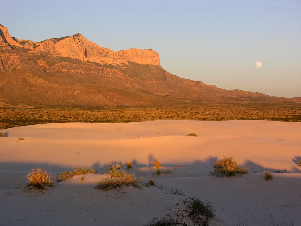 Moon over the mountains and dunes at Guadalupe Mountains National Park
