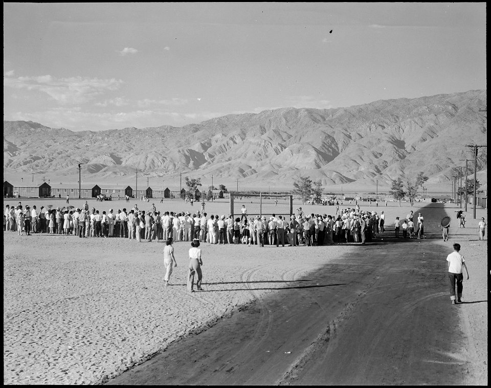 Manzanar Relocation Center, Manzanar, California. Evacuees watching a baseball game at this War Rel . . . - NARA - 538061