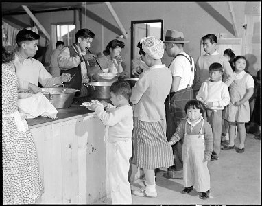 Heart Mountain Relocation Center, Heart Mountain, Wyoming. Dinner is served caffeteria style to you . . . - NARA - 538790
