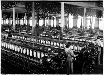 No caption. Three spinners in spinning room. - NARA - 523510