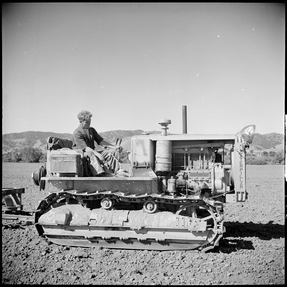 Monterey County, California. Rural youth. Mechanization, the agricultural employee. leveling a field with a... - NARA - 532174 photo