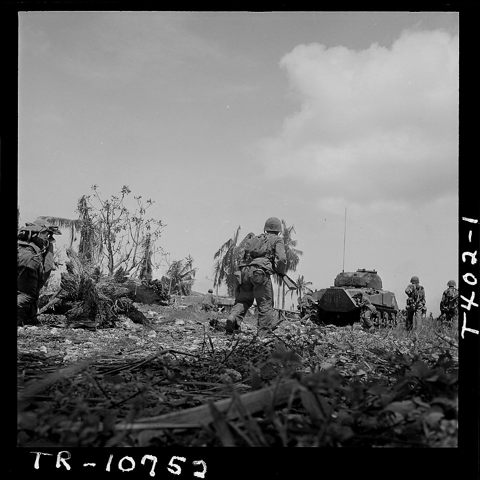 Marines advance behind tank on Guam - NARA - 520967