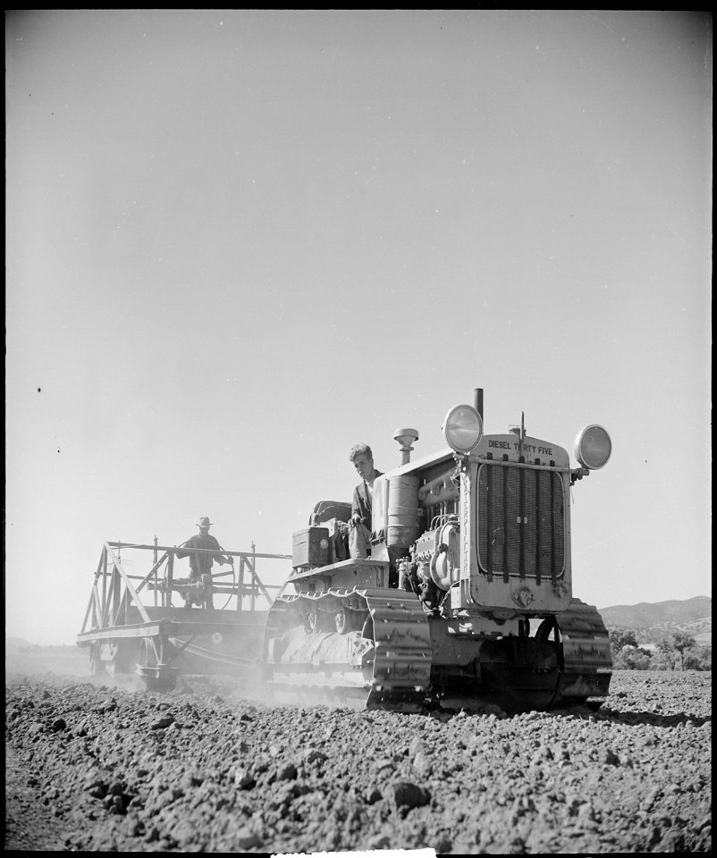 Monterey County, California. Rural youth. Mechanization, the agricultural employee. leveling a field. The fellow on... - NARA - 532176 photo