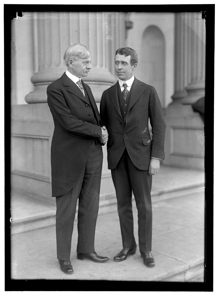 MITCHELL, EWING. SHAKING HANDS WITH VICE PRESIDENT MARSHALL LCCN2016867105