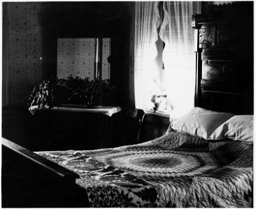 Lancaster County, Pennsylvania. This is a bedroom in a conservative Mennonite household. The bed a . . . - NARA - 521054 photo