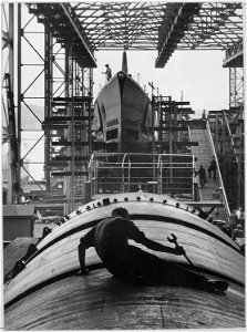 Man working on hull of U.S. submarine at Electric Boat Company, Groton, Connecticut - NARA - 520851