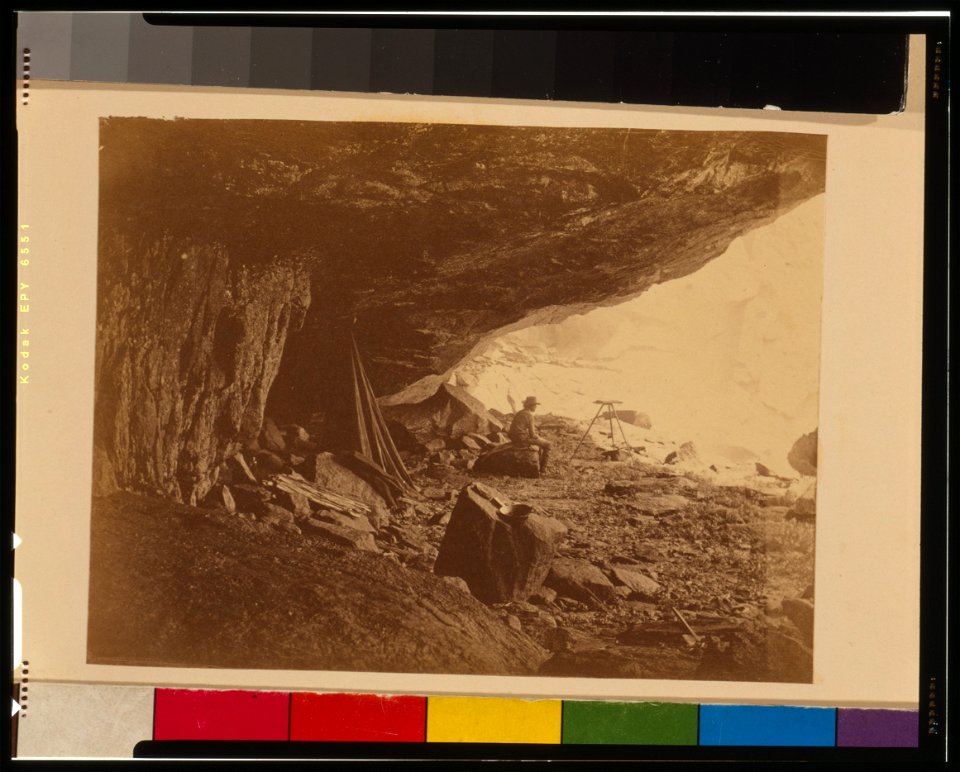 Man seated beneath rock formation at the Upper Yosemite Fall, Yosemite National Park, Calif. LCCN95514110