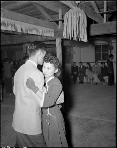 Gila River Relocation Center, Rivers, Arizona. A view at a dance given at camp ^2 to celebrate the . . . - NARA - 538658 photo