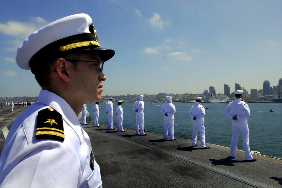 US Navy 090706-N-2475A-101 Lt. Robert Tressler, from Selinsgrove, Penn. stands at parade rest on the flight deck as aircraft carrier USS John C. Stennis (CVN 74) pulls into San Diego, Calif