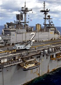 US Navy 090710-N-9950J-722 ailors assigned to the amphibious assault ship USS Essex (LHD 2) move a CH-46E Sea Knight helicopter on the ship's flight deck during force integrated training in preparation for exercise Talisman Sab