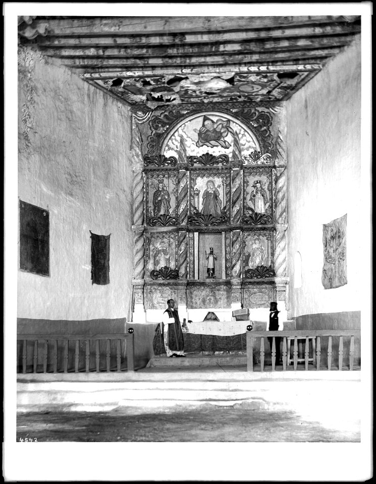 Priest at the altar in old church at the Acoma Pueblo, New Mexico, 1886 (CHS-4542)