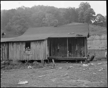 Monroe Jones, a miner, his wife and five children live in this four room house for which they pay $9 monthly, this... - NARA - 541186 photo