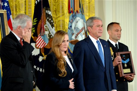 US Navy 071022-N-2653P-221 President George W. Bush stands beside Daniel and Maureen Murphy, the parents of Navy SEAL Lt. Michael Murphy, before presenting them with their son's Medal of Honor at the White House