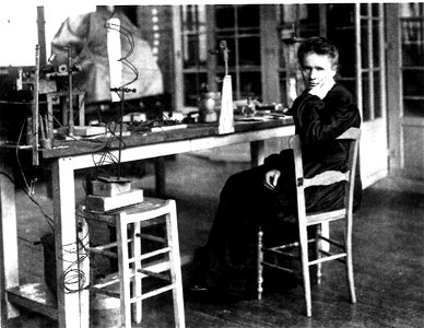 Marie Curie on a chair in her laboratory