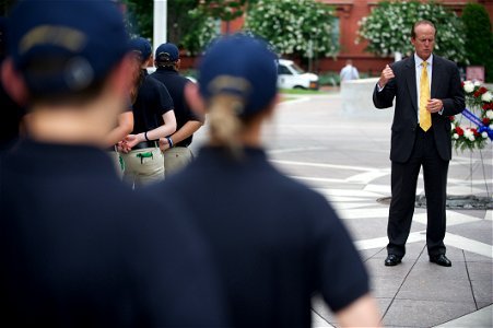 Man speaks to law enforcement explorers at National Law Enforcement Officers Memorial 3 photo