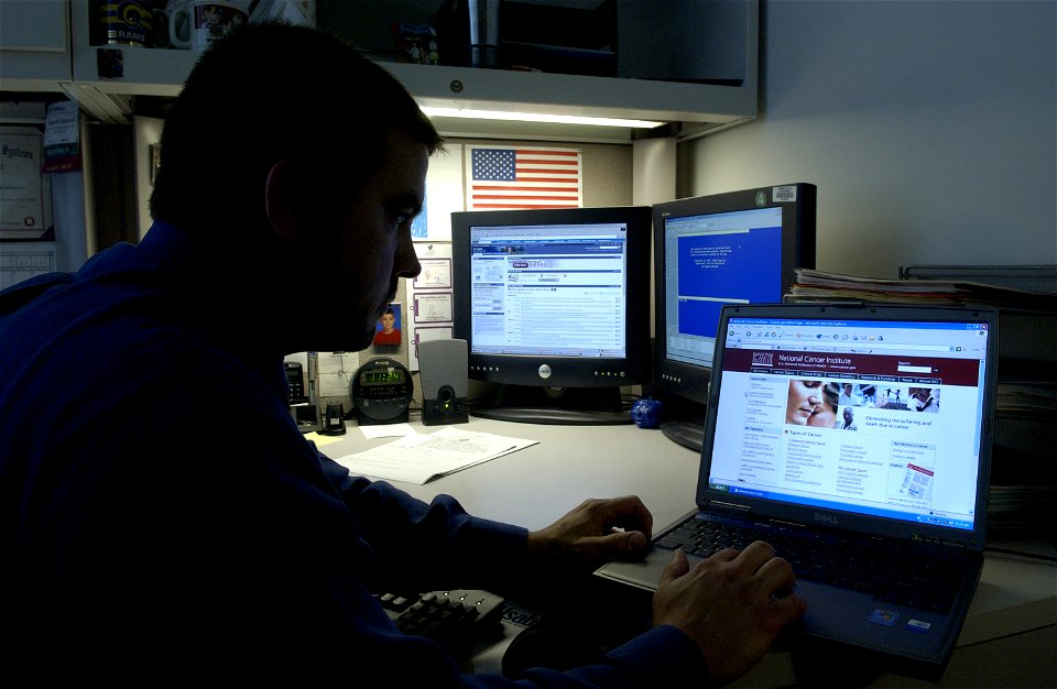 Man uses laptop (1) photo