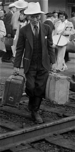 Man detail, Woodland, California. Families of Japanese ancestry leave the station platform to board the train f . . . - NARA - 537810 (cropped) photo