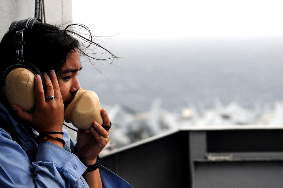 US Navy 090701-N-2344B-016 Seaman Recruit Alexis Ensley stands the port-aft lookout watch on the island of aircraft carrier USS Ronald Reagan (CVN 76)