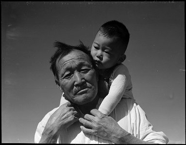Manzanar Relocation Center, Manzanar, California. Grandfather and grandson of Japanese ancestry at . . . - NARA - 537994 photo