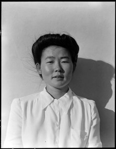 Manzanar Relocation Center, Manzanar, California. Chico Sakaguchi, born in Los Angeles in 1918, and . . . - NARA - 538003 photo